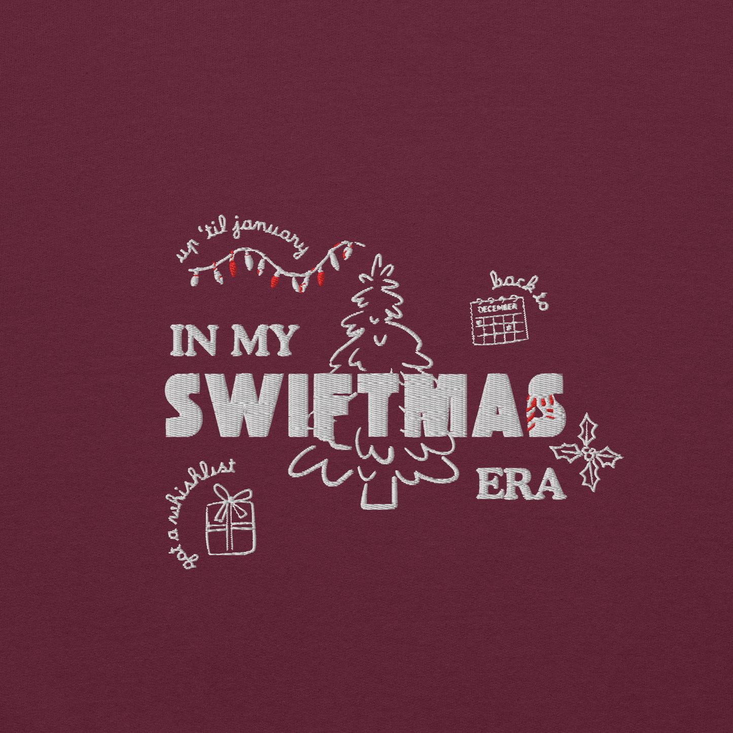 Maroon sweatshirt with red “In My Swiftmas Era” graphic featuring festive Christmas doodles, Taylor Swift inspired holiday sweatshirt for Swiftie fans