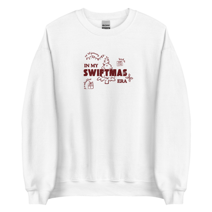 White sweatshirt with red “In My Swiftmas Era” graphic featuring festive Christmas doodles, Taylor Swift inspired holiday sweatshirt for Swiftie fans