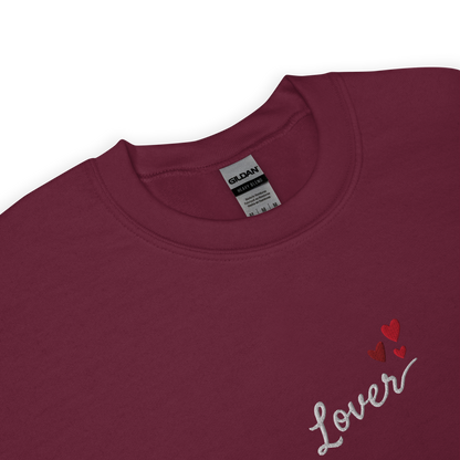Maroon Lover sweatshirt inspired by Taylor Swift’s Lover era, featuring minimalist ‘Lover’ text with small heart details on a cozy pastel crewneck, soft romantic pop aesthetic merch