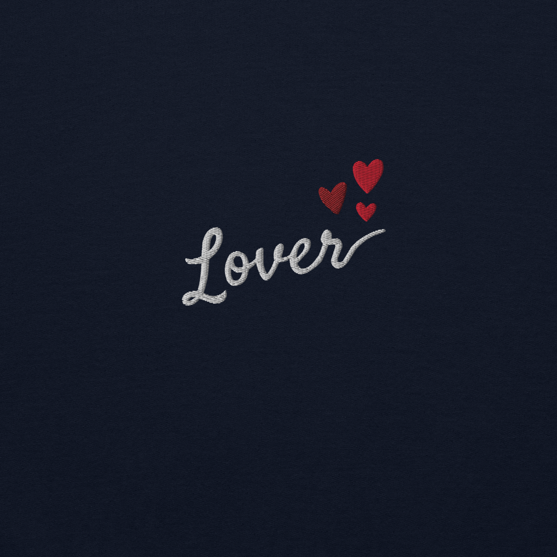 Navy Lover sweatshirt inspired by Taylor Swift’s Lover era, featuring minimalist ‘Lover’ text with small heart details on a cozy pastel crewneck, soft romantic pop aesthetic merch