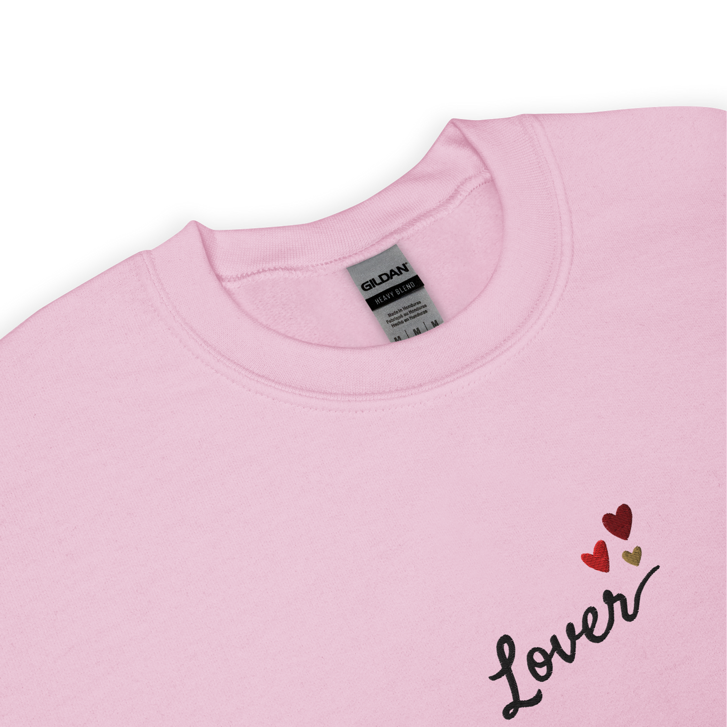 Light pink Lover sweatshirt inspired by Taylor Swift’s Lover era, featuring minimalist ‘Lover’ text with small heart details on a cozy pastel crewneck, soft romantic pop aesthetic merch