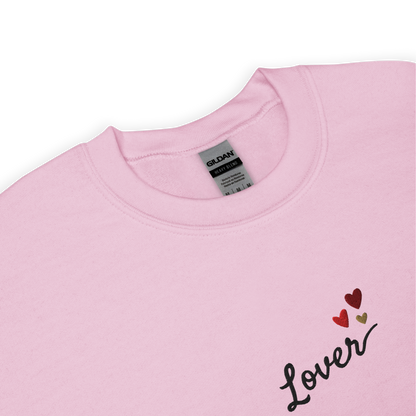 Light pink Lover sweatshirt inspired by Taylor Swift’s Lover era, featuring minimalist ‘Lover’ text with small heart details on a cozy pastel crewneck, soft romantic pop aesthetic merch