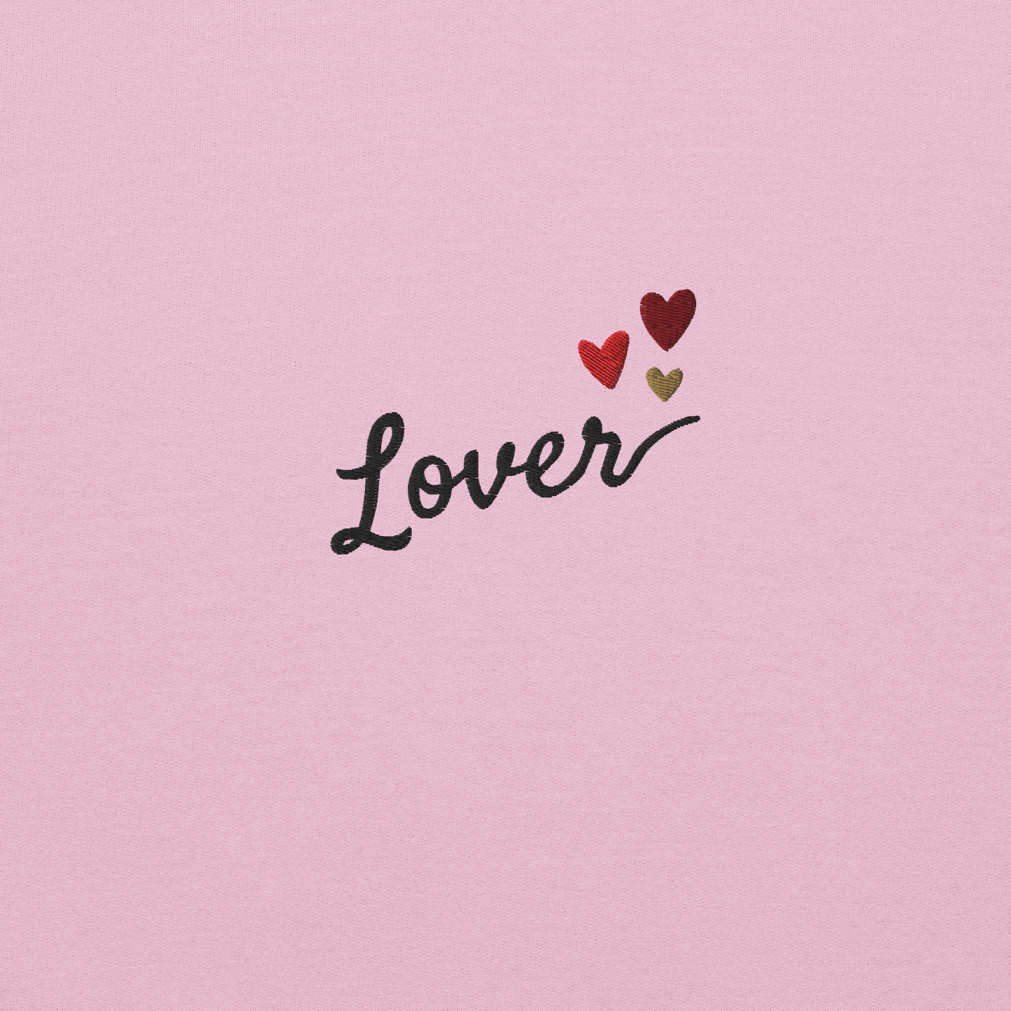 Light pink Lover sweatshirt inspired by Taylor Swift’s Lover era, featuring minimalist ‘Lover’ text with small heart details on a cozy pastel crewneck, soft romantic pop aesthetic merch
