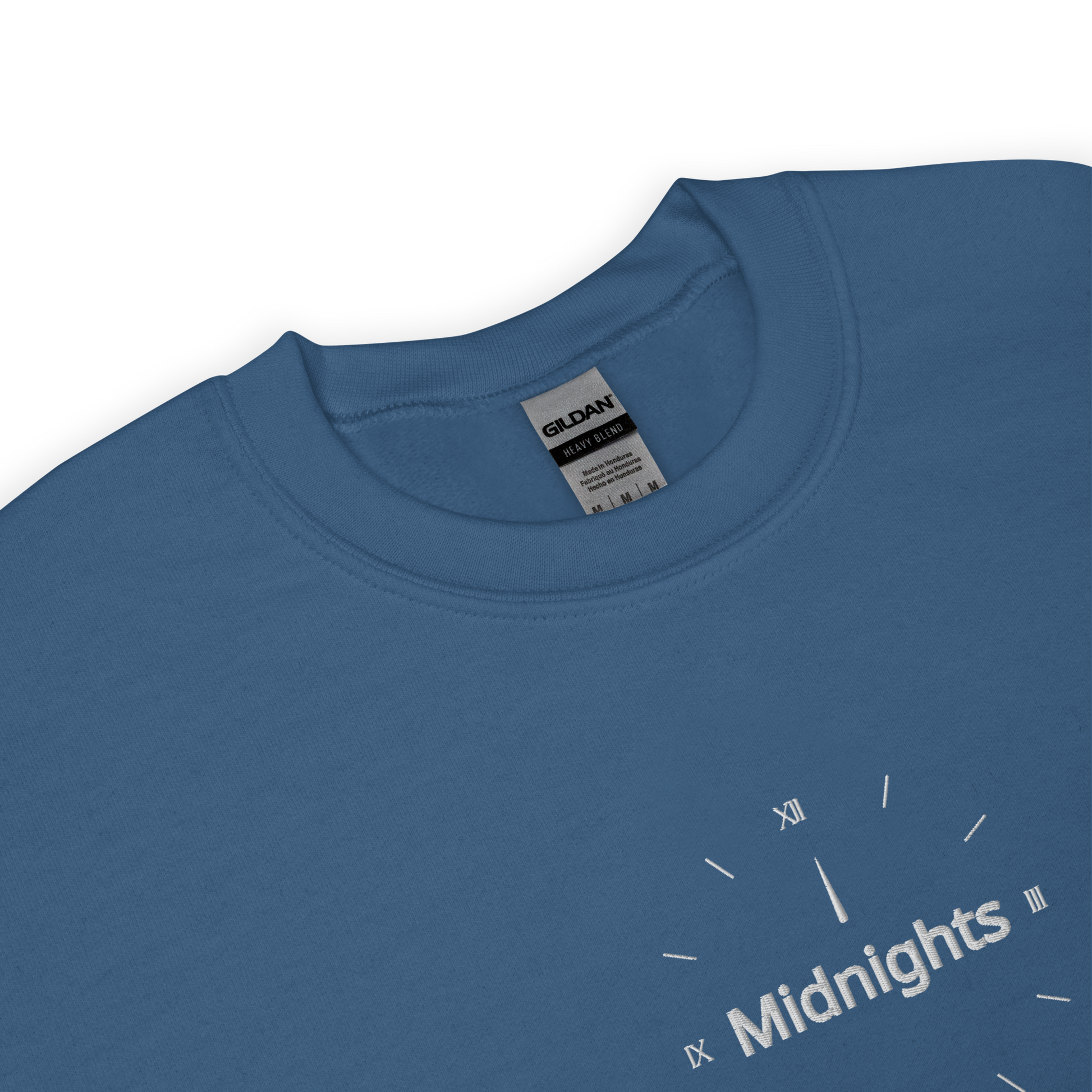 Blue crewneck sweatshirt featuring “Midnights” text with a minimalist clock graphic on the chest, inspired by Taylor Swift’s Midnights album era, cozy unisex pullover fan merch