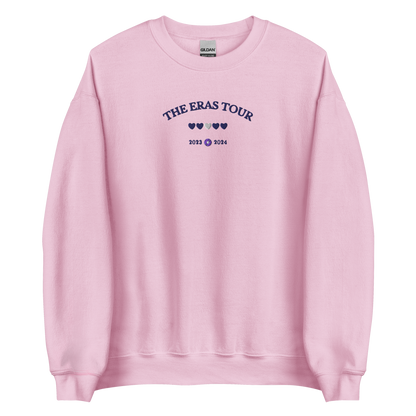 Pink Taylor Swift Eras Tour sweatshirt featuring “The Eras Tour” graphic with heart icons and 2023–2024 dates, inspired by Taylor Swift’s record-breaking tour. Unisex oversized crewneck, perfect for Swifties, concert outfits, and official Eras Tour merch style looks
