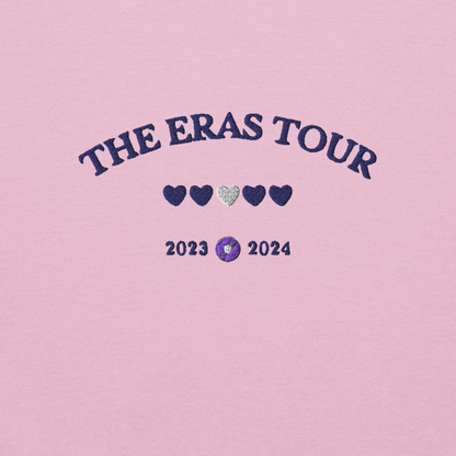Pink Taylor Swift Eras Tour sweatshirt featuring “The Eras Tour” graphic with heart icons and 2023–2024 dates, inspired by Taylor Swift’s record-breaking tour. Unisex oversized crewneck, perfect for Swifties, concert outfits, and official Eras Tour merch style looks