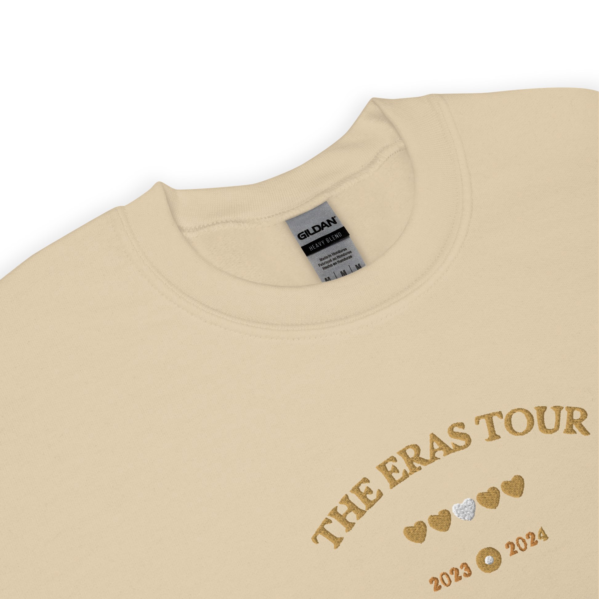 Sand Taylor Swift Eras Tour sweatshirt featuring “The Eras Tour” graphic with heart icons and 2023–2024 dates, inspired by Taylor Swift’s record-breaking tour. Unisex oversized crewneck, perfect for Swifties, concert outfits, and official Eras Tour merch style looks