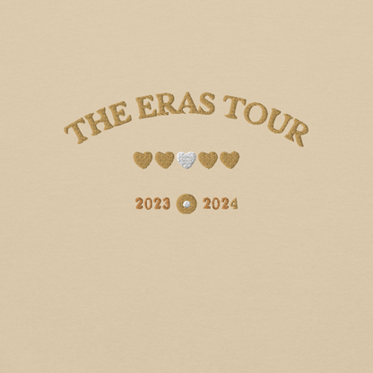 Sand Taylor Swift Eras Tour sweatshirt featuring “The Eras Tour” graphic with heart icons and 2023–2024 dates, inspired by Taylor Swift’s record-breaking tour. Unisex oversized crewneck, perfect for Swifties, concert outfits, and official Eras Tour merch style looks
