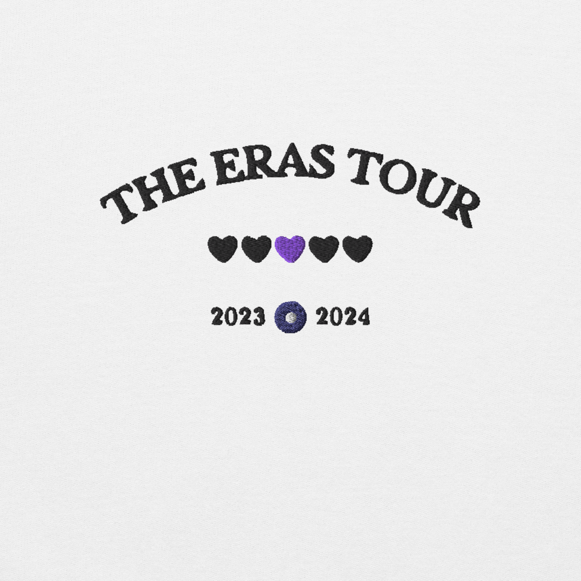 White Taylor Swift Eras Tour sweatshirt featuring “The Eras Tour” graphic with heart icons and 2023–2024 dates, inspired by Taylor Swift’s record-breaking tour. Unisex oversized crewneck, perfect for Swifties, concert outfits, and official Eras Tour merch style looks