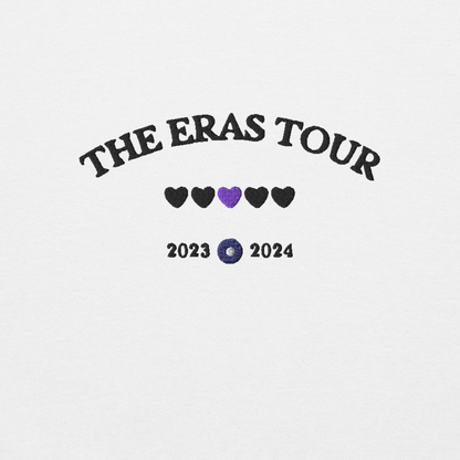 White Taylor Swift Eras Tour sweatshirt featuring “The Eras Tour” graphic with heart icons and 2023–2024 dates, inspired by Taylor Swift’s record-breaking tour. Unisex oversized crewneck, perfect for Swifties, concert outfits, and official Eras Tour merch style looks