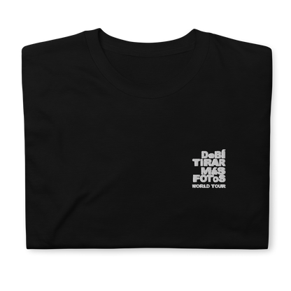 Black crewneck t-shirt featuring small white DTMF World Tour graphic and text inspired by Bad Bunny’s DtMF (Debí Tirar Más Fotos) album and global tour merchandise