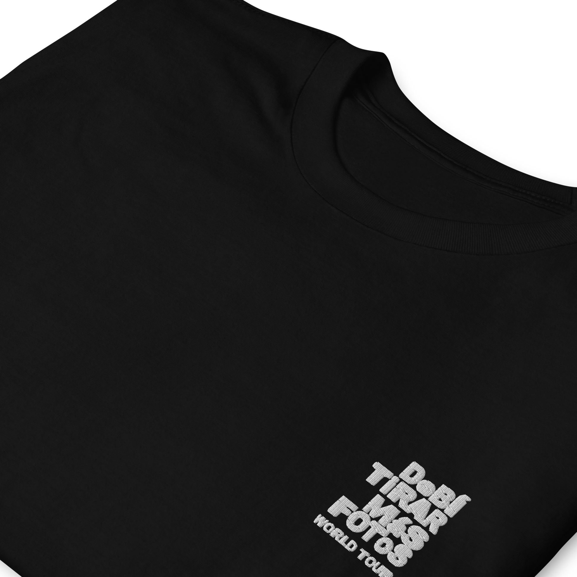 Black crewneck t-shirt featuring small white DTMF World Tour graphic and text inspired by Bad Bunny’s DtMF (Debí Tirar Más Fotos) album and global tour merchandise