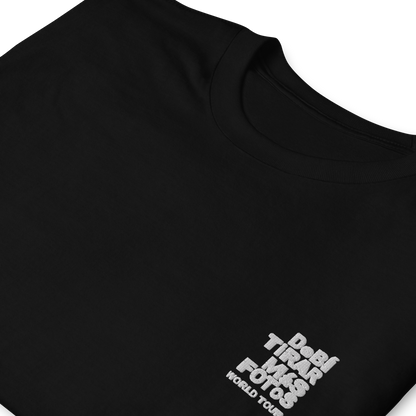 Black crewneck t-shirt featuring small white DTMF World Tour graphic and text inspired by Bad Bunny’s DtMF (Debí Tirar Más Fotos) album and global tour merchandise