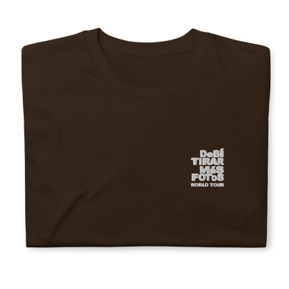 Dark chocolate crewneck t-shirt featuring small white DTMF World Tour graphic and text inspired by Bad Bunny’s DtMF (Debí Tirar Más Fotos) album and global tour merchandise