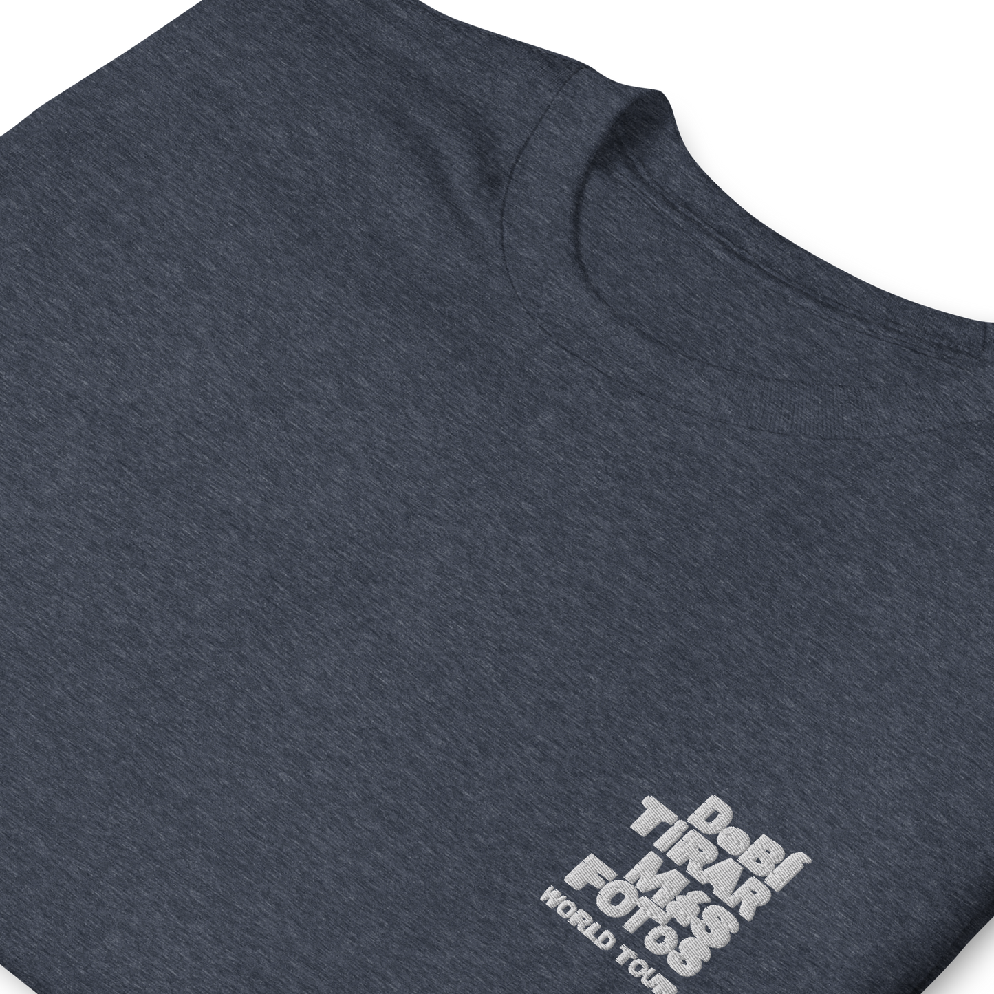 Heather navy crewneck t-shirt featuring small white DTMF World Tour graphic and text inspired by Bad Bunny’s DtMF (Debí Tirar Más Fotos) album and global tour merchandise