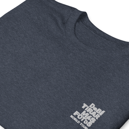 Heather navy crewneck t-shirt featuring small white DTMF World Tour graphic and text inspired by Bad Bunny’s DtMF (Debí Tirar Más Fotos) album and global tour merchandise