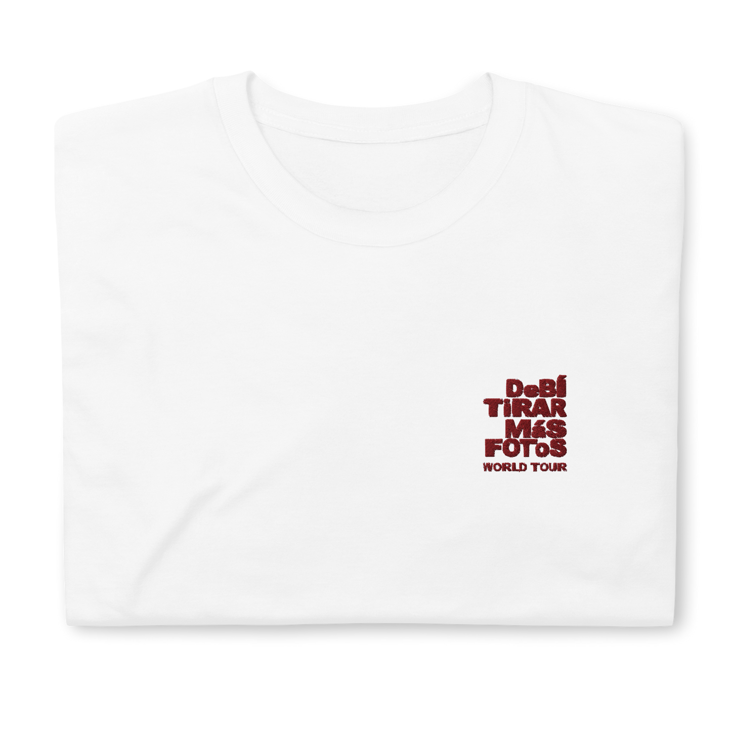 White crewneck t-shirt featuring small red DTMF World Tour graphic and text inspired by Bad Bunny’s DtMF (Debí Tirar Más Fotos) album and global tour merchandise