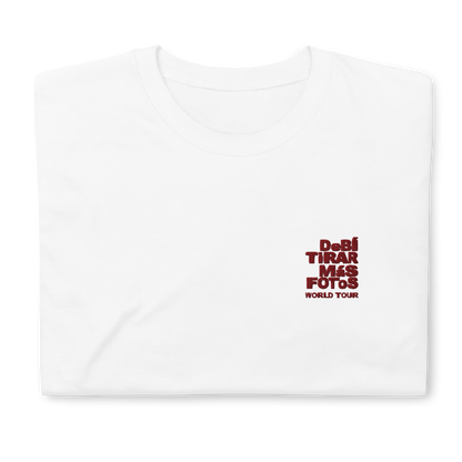 White crewneck t-shirt featuring small red DTMF World Tour graphic and text inspired by Bad Bunny’s DtMF (Debí Tirar Más Fotos) album and global tour merchandise