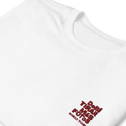 White crewneck t-shirt featuring small red DTMF World Tour graphic and text inspired by Bad Bunny’s DtMF (Debí Tirar Más Fotos) album and global tour merchandise