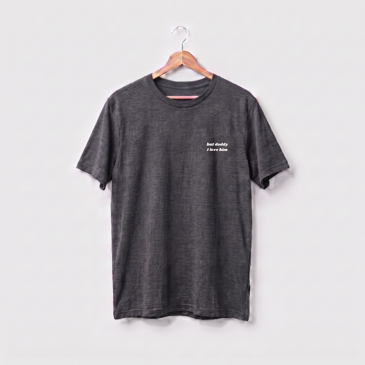 Dark heather Taylor Swift t-shirt embroidered with 'but daddy I love him' in white script text on the left chest.