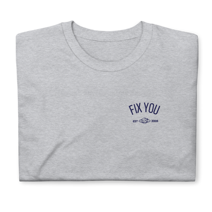 Grey minimalist t-shirt featuring blue “Fix You” typography with subtle graphic detail - Coldplay inspired band merch, aesthetic Coldplay “Fix You” song fan apparel