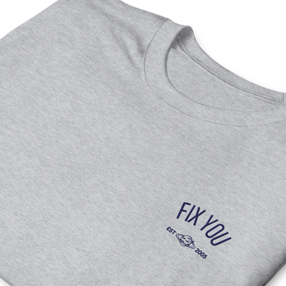 Grey minimalist t-shirt featuring blue “Fix You” typography with subtle graphic detail - Coldplay inspired band merch, aesthetic Coldplay “Fix You” song fan apparel