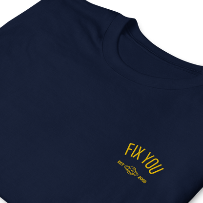 Navy blue minimalist t-shirt featuring yellow “Fix You” typography with subtle graphic detail - Coldplay inspired band merch, aesthetic Coldplay “Fix You” song fan apparel