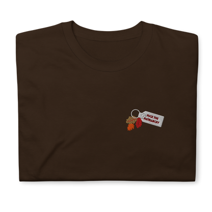 Brown t-shirt with small embroidered “Fuck the Patriarchy” keychain design and autumn leaves inspired by Taylor Swift’s All Too Well lyric, minimalist Swiftie fan shirt