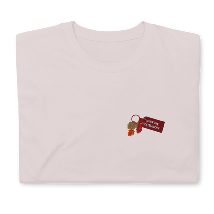 Grey t-shirt with small embroidered “Fuck the Patriarchy” keychain design and autumn leaves inspired by Taylor Swift’s All Too Well lyric, minimalist Swiftie fan shirt