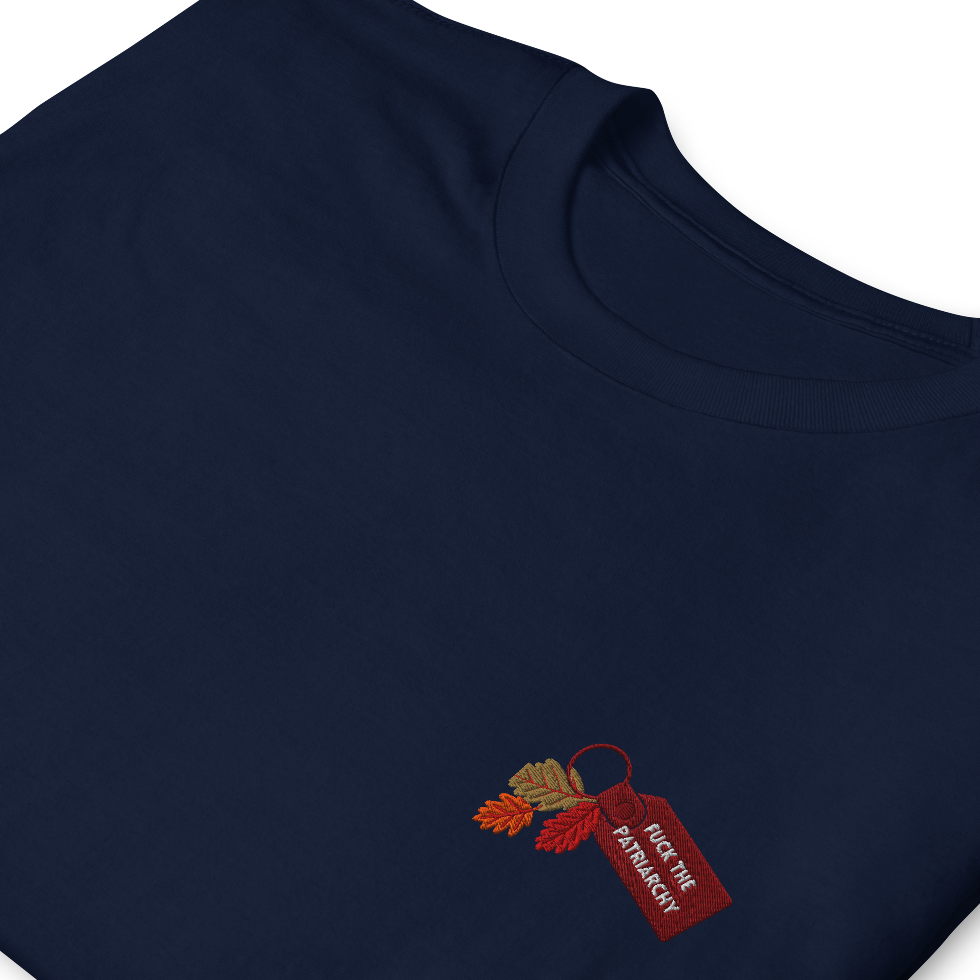 Navy blue t-shirt with small embroidered “Fuck the Patriarchy” keychain design and autumn leaves inspired by Taylor Swift’s All Too Well lyric, minimalist Swiftie fan shirt