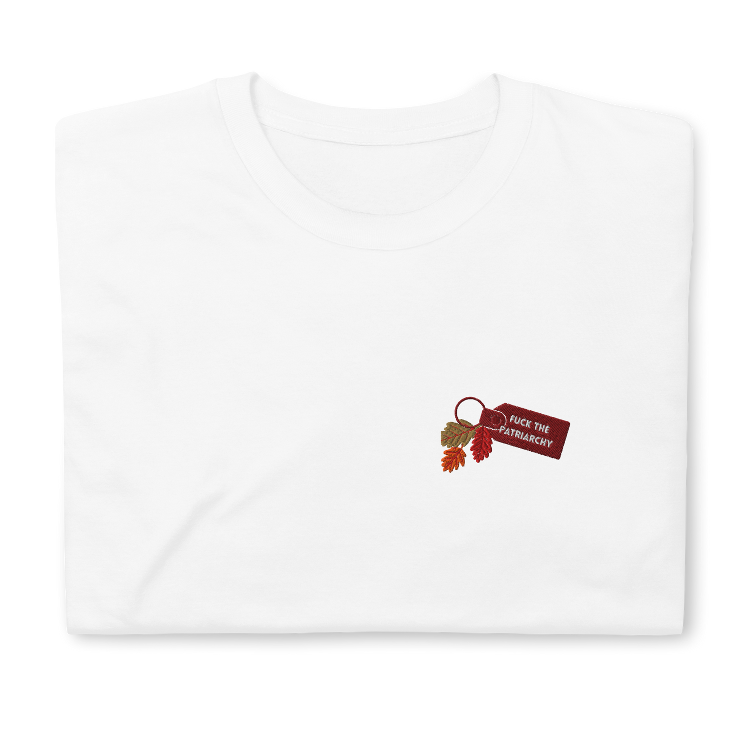 White t-shirt with small embroidered “Fuck the Patriarchy” keychain design and autumn leaves inspired by Taylor Swift’s All Too Well lyric, minimalist Swiftie fan shirt