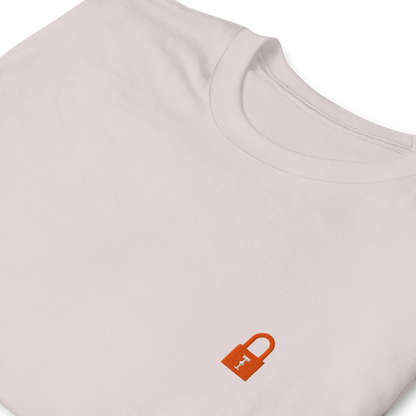 Taylor Swift Showgirl era inspired ice grey t-shirt with minimalist lock graphic, aesthetic Swiftie fan merchandise tee